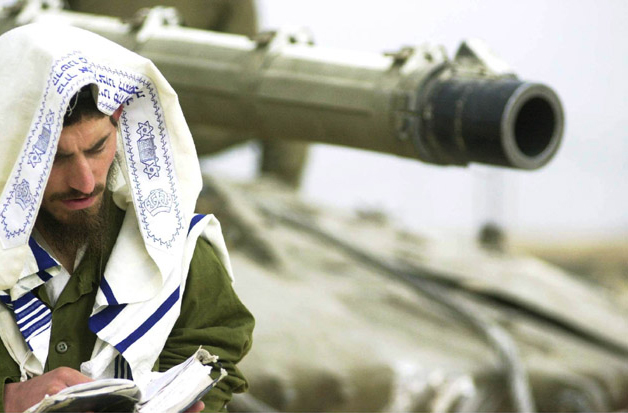 An officer of the Golani Brigade during morning prayer after entering the city of Ramallah